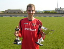 Cory Flint of Great Rocks is pictured with the Charles Lynch Cup and his man of the match award 